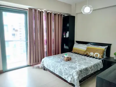 a bedroom with a bed with a stuffed animal on it at ROOM NEAR AIRPORT BY RQUi in Manila