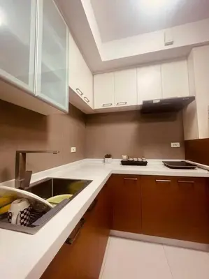 a kitchen with a sink and a counter top at 2BR-T31807 Sunshine100 Pool Billiard 70 inches TV Karaoke in Manila