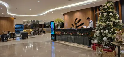 a christmas tree in the lobby of a hotel at Jay Suite in Manila