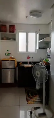 a kitchen with a sink and a counter top at Birch Tower by the Bay Studio type in Manila