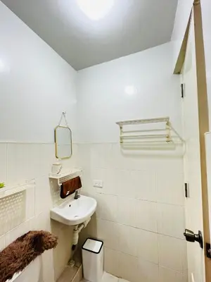 a white bathroom with a sink and a mirror at Fablo Getaway in Santa Rosa