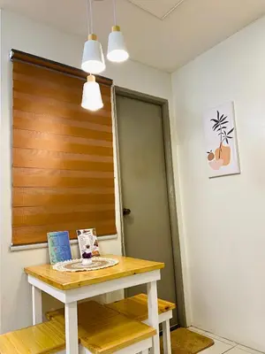 a table in a room with a wooden door at Fablo Getaway in Santa Rosa