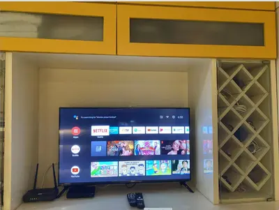 a flat screen tv in a wine cellar at Cozy 1BR Condo at SM Lights Mandaluyong City in Manila