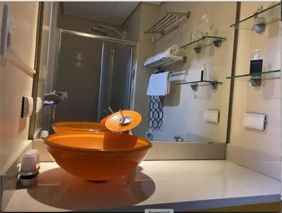 a bathroom with a wooden toilet and a shower at Cozy 1BR Condo at SM Lights Mandaluyong City in Manila