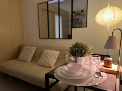 a living room with a coffee table with a couch at Makati High rise 1 Bedroom Condo with Balcony in Manila