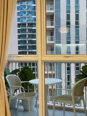 a view of a balcony with chairs and a table at Chic and modern studio in Manila