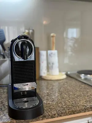 a black toaster sitting on a kitchen counter at Chic and modern studio in Manila
