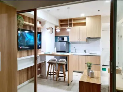 a kitchen with a counter and stools in it at Azure urban resort residences, BAHAMAS tower Japandi model in Manila