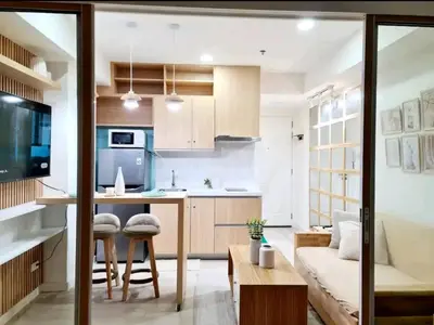 a kitchen and living room with a couch and a table at Azure urban resort residences, BAHAMAS tower Japandi model in Manila