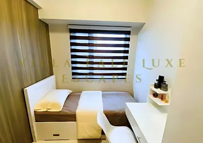 a small bedroom with a bed and a window at 1 Bed Room Coast Residence at Heart of Metro Manila - Pasay City in Manila