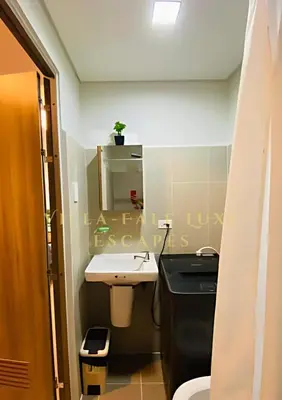 a small bathroom with a sink and a mirror at 1 Bed Room Coast Residence at Heart of Metro Manila - Pasay City in Manila