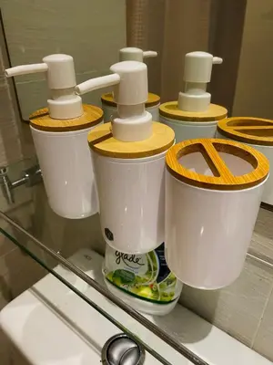 a row of toilets sitting on a glass counter at Azure Staycation by the clouds in Manila