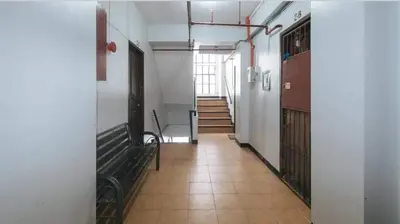 an empty hallway with a staircase in a building at Marco's Economy Room For Rent near NAIA in Manila