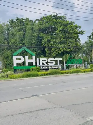 a sign for a plant on the side of a road at Homestay at Phirst Park Homes Tanza in Tanza