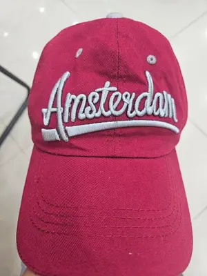 a red baseball cap with an american team on it at Cavite budget condo in Cavite