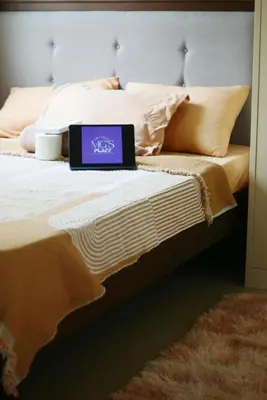 a laptop computer sitting on top of a bed at MG Place -2 BR condo unit at SMDC Charm Residences, Cainta, Rizal, 1900 in Cainta