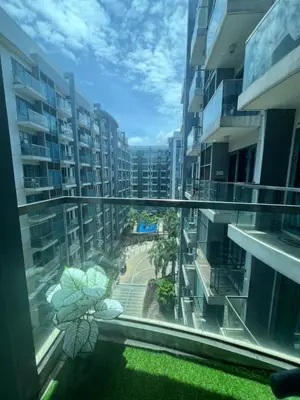 a view from the balcony of a apartment building at one palm tree villas &two palm tree villas in Manila