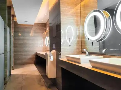 a bathroom with two sinks and a mirror at 66F 1 BR Penthouse with 2 Balconies Panoramic View in Manila