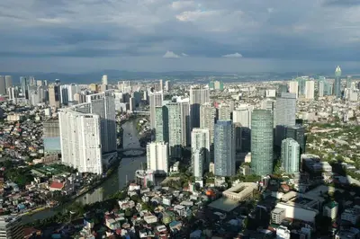 an aerial view of a city with tall buildings at 66F 1 BR Penthouse with 2 Balconies Panoramic View in Manila