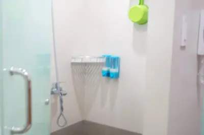 a bathroom with a shower and a sink with a shower at Studio 203 T2 Sunshine100 Wifi PoolAccess BunkBed SofaBed in Manila