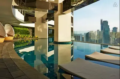 a swimming pool with a view of a city skyline at 45F Gramercy Corner Studio Wifi Netflix SmartTV free use Pool Gym in Manila