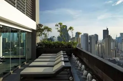 a balcony of a building with a view of a city at 45F Gramercy Corner Studio Wifi Netflix SmartTV free use Pool Gym in Manila