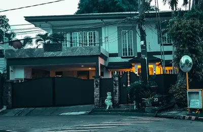 a house with a white statue in front of it at Elegant Villa in Manila