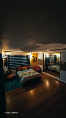 a bedroom with a bed and a couch in it at Elegant Villa in Manila