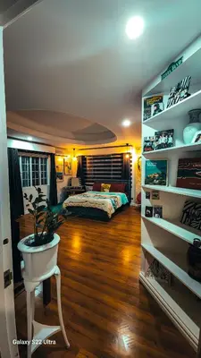 a bedroom with a bed and a potted plant at Elegant Villa in Manila
