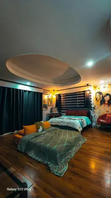 a bedroom with a large bed in the middle of it at Elegant Villa in Manila