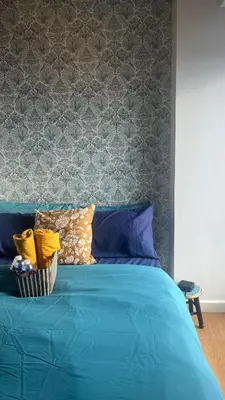 a blue bed with pillows on top of it at 8Adriatico Penthouse Studio Unit! Walk Away to US Embassy and St Lukes Ermita in Manila