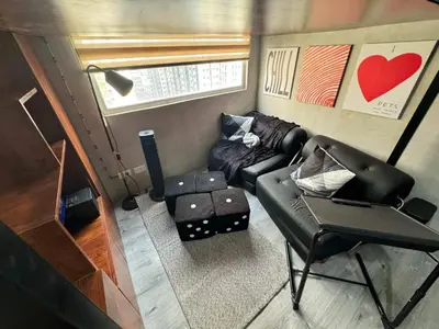 an aerial view of a living room in a tiny house at Urban Hive 1821 in Manila