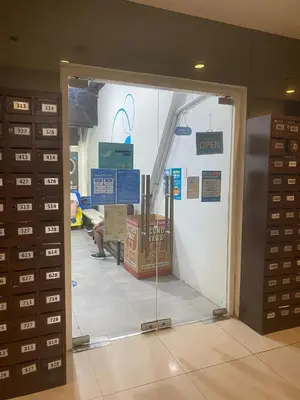 a glass door in a room with some boxes at Urban Hive 1821 in Manila