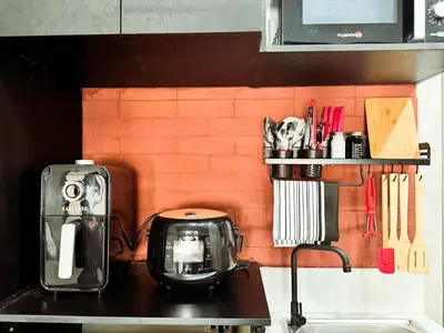 a kitchen counter with a toaster and a toaster at Urban Hive 1821 in Manila