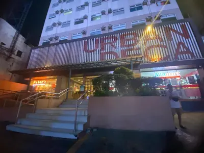 a man standing in front of a building with stairs at Urban Hive 1821 in Manila