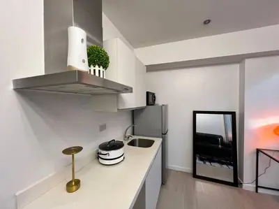 a kitchen with a sink and a counter top at Azure Playfull Living 1 bedroom in Manila