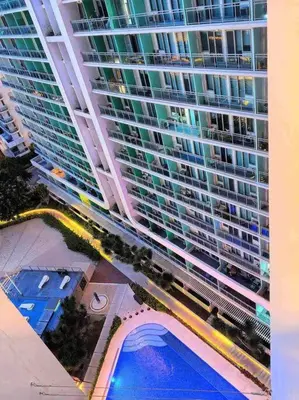 an overhead view of a large building with a swimming pool at Azure Playfull Living 1 bedroom in Manila