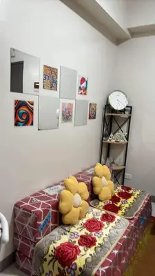 two stuffed animals sitting on a bed in a bedroom at Solana Tower 1 New and Very Neat Studio Unit near SM Manila in Manila