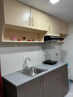 a kitchen with a sink and a counter top at Solana Tower 1 New and Very Neat Studio Unit near SM Manila in Manila
