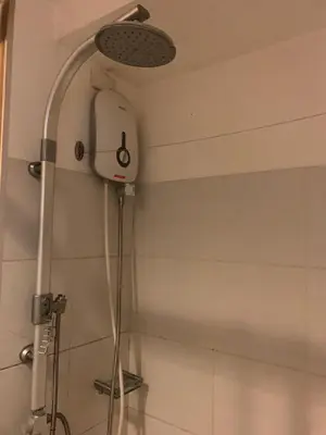 a shower in a bathroom with a shower head at CASSa LISHA in Manila