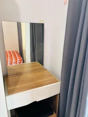 a bedroom with a bunk bed with a mirror at Flores Place At Sea Residences MOA in Manila