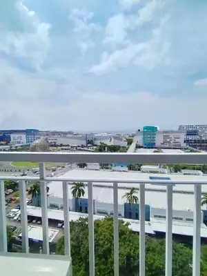 a view of a city from a balcony at Comfystay at Shell Residences in Manila