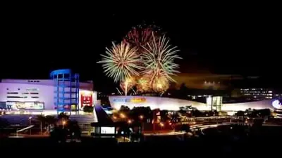 a fireworks display in front of a building at night at Sea Residences Condo SM Mall of Asia Entertainment District in Manila