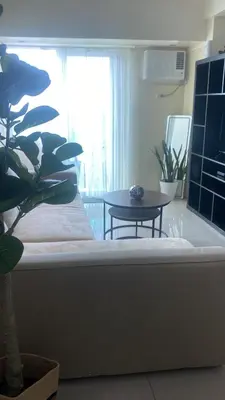 a room with a couch and a table and a window at 1Bdrm Condo at Makati w Balcony view of Mnla Bay in Manila