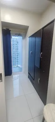 a bathroom with a large window in a building at Aircon Budget Room for 4 persons in Makati in Manila