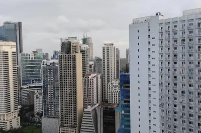a view of a large city with tall buildings at Aircon Budget Room for 4 persons in Makati in Manila