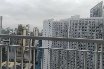 a view of a city skyline with tall buildings at Aircon Budget Room for 4 persons in Makati in Manila