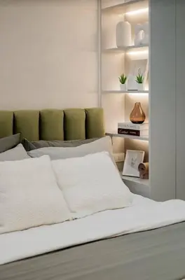 a white bed with white pillows in a room at Lamour Talia in Manila