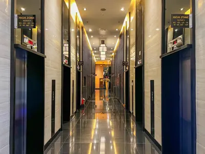 an empty hallway of a building with a hallway at BRAND NEW Casa Airabella with Netflix & Makati City Skyline in Manila