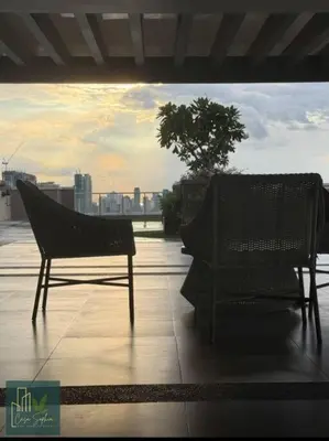 two chairs sitting on the roof of a building at CASA SOPHIA Affordable Condo Near Bonifacio Global City BGC CBD in Manila